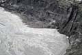 the_sand_and_water_mixture_in_the_middle_is_pumped_to_open_storage_areas_called_tailings_ponds