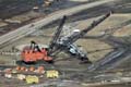 two_machines_some_companies_used_in_mining_up_until_2006_a_dragline_on_the_left